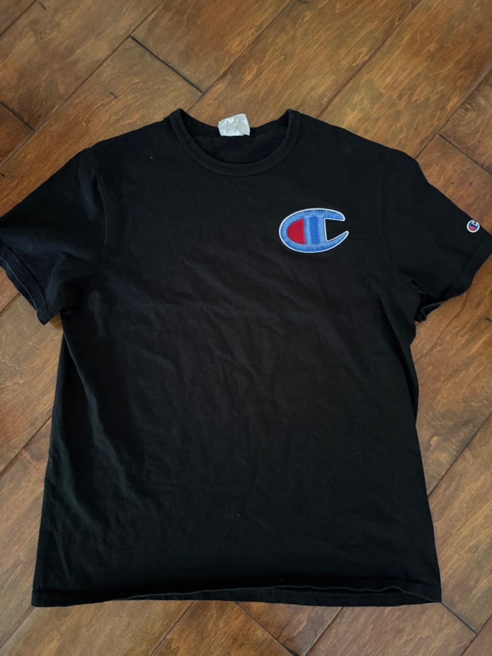 Champion men’s L Black Short Sleeve Tee with Blue & Red patch Logo